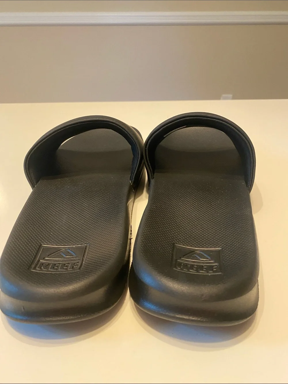 Reef Men’s Black Slide Sandals with White Logo